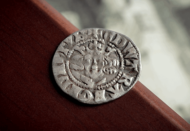 Edward I Silver Penny with red and white background