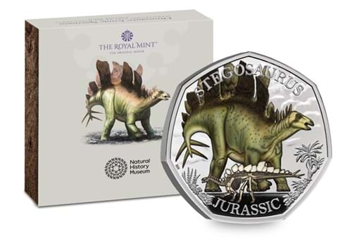 434G UK 2024 Stegosaurus Silver Proof Colour 50P Coin Displayed In Front Of Packaging