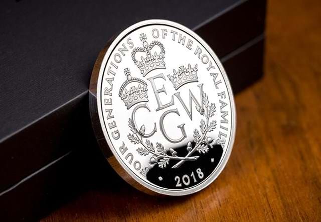 UK 2018 Four Generations Of Royalty Silver Proof Five Pound Coin Reverse leaning against display box