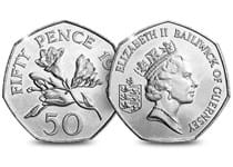 Guernsey Freesia Flowers 50p Coin. Reverse features Guernsey Freesia flowers, and the obverse features Raphael David Maklouf's engraving of Queen Elizabeth II and the lettering Bailwick of Geurnsey.