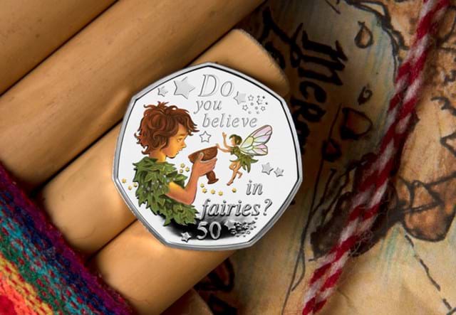 The 2020 Official Peter Pan Silver Proof 50p Reverse on wooden surface