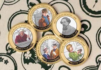 Charles Dickens 150th Anniversary Silver £2 Set reverses on fabric surface