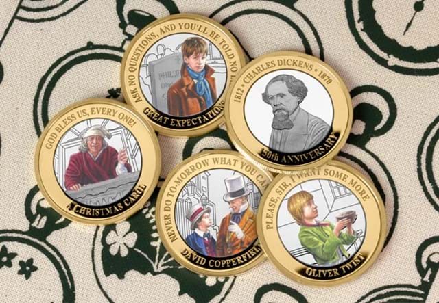 Charles Dickens 150th Anniversary Silver £2 Set reverses on fabric surface