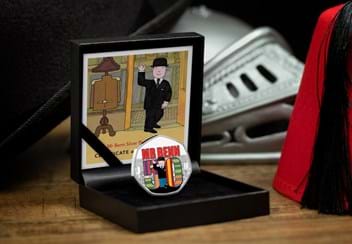 Mr Benn 50th Anniversary Silver Proof 50p Coin in display box on wooden surface