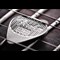 Fender-Sterling-Silver-Playable-Guitar-Pick-Product-Images-Lifestyle-Between-Strings.jpg
