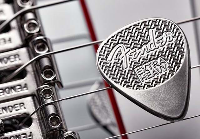 Fender-Sterling-Silver-Playable-Guitar-Pick-Product-Images-Lifetsyle-on-strings.jpg