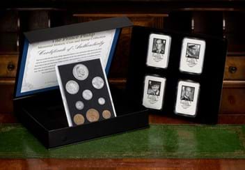 The Prince Philip Memorial Historic Coin and Stamp Collection on wooden surface