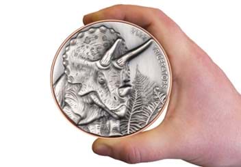 2022 Bi-Metal Triceratops Supersize Silver Coin in hand