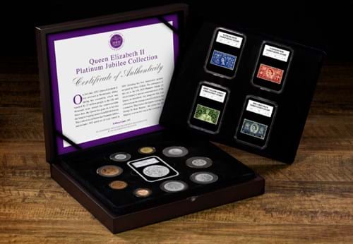 The QEII Platinum Jubilee Coin and Stamp Collection displayed on wooden surface