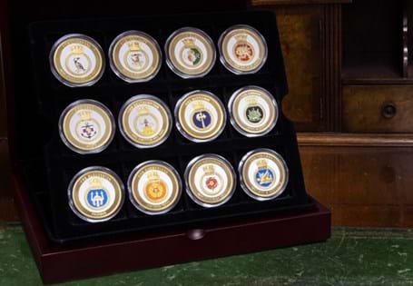 12 24ct Gold-Plated medals, each featuring a full colour crest finished with colour enamel. Each medal includes the ships motto worded underneath to honour the most well-known ships in the Royal Navy.