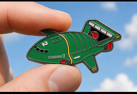 This pin badge features one of the most iconic vehicles in British television history  - Thunderbird 2. Designed by acclaimed comic book artist, Lee Sullivan, and finished with premium enamel. 